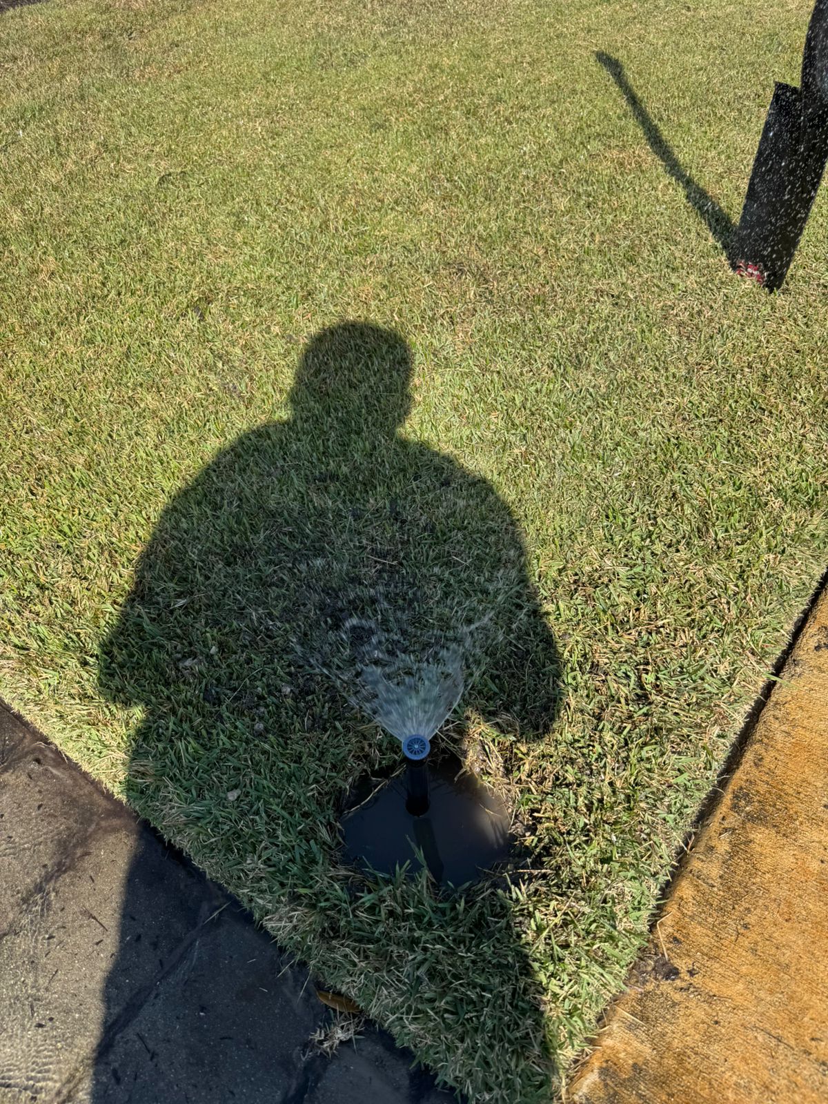 Adjusting a pop-up sprinkler head