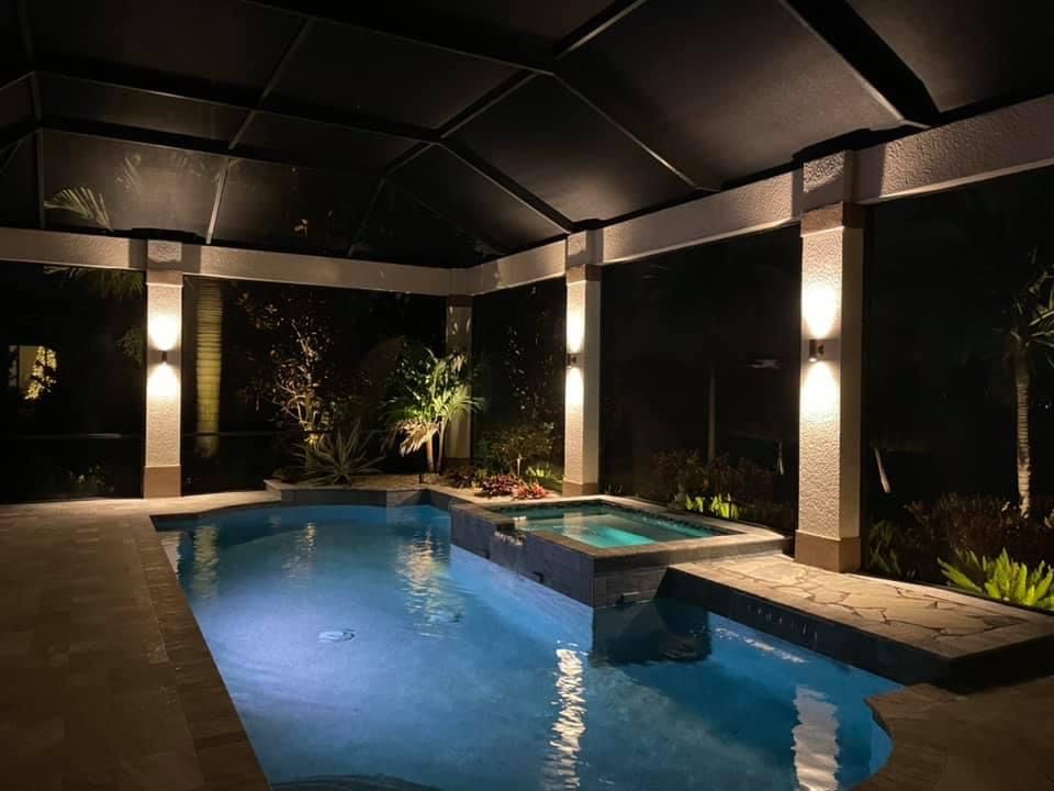 Pool enclosure with ambient column lights